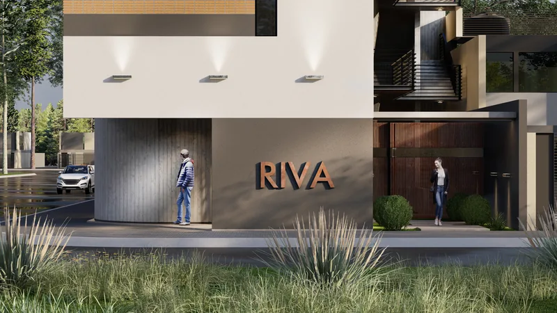 Render del acceso peatonal del Edificio RIVA, con el nombre en relieve sobre el muro claro y las luminarias embutidas en el alero.